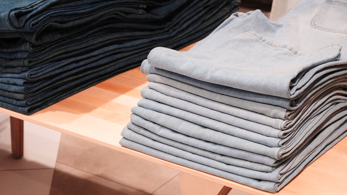 Neatly folded blue denim jeans trousers