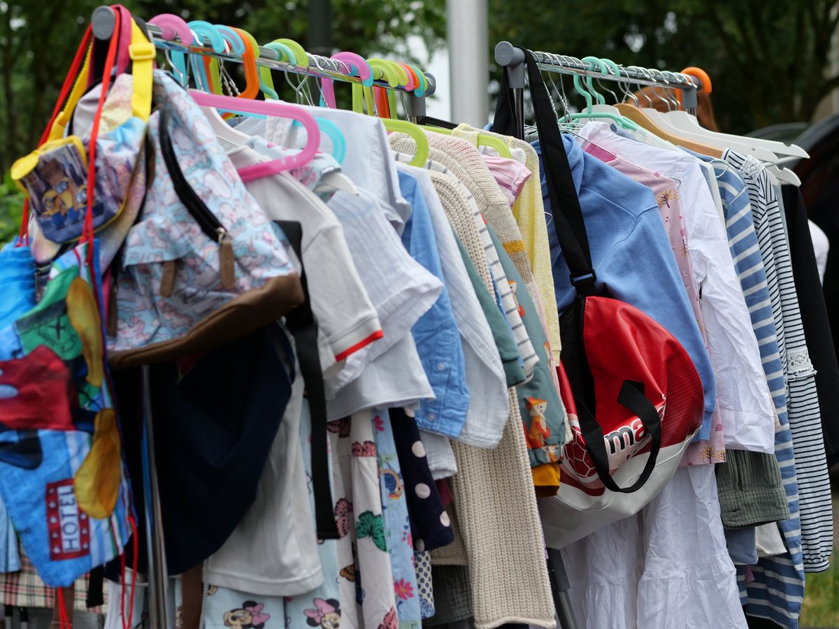 Colorful kids clothing hanging on a secondhand clothing rack