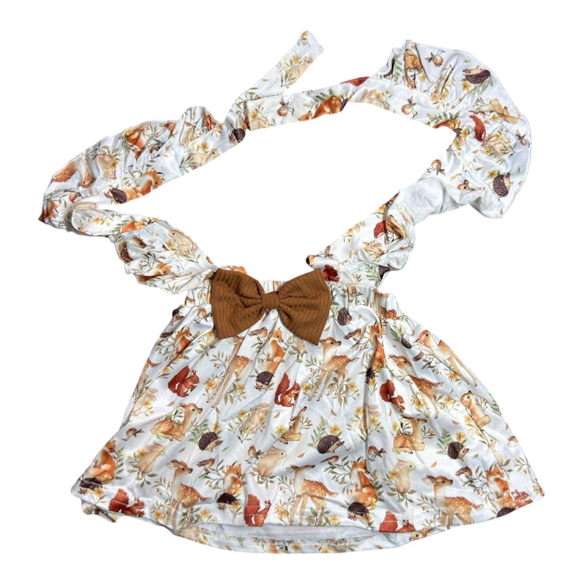 Childrens dress with brown bow and puffed sleeves featuring autumn woodland animal print